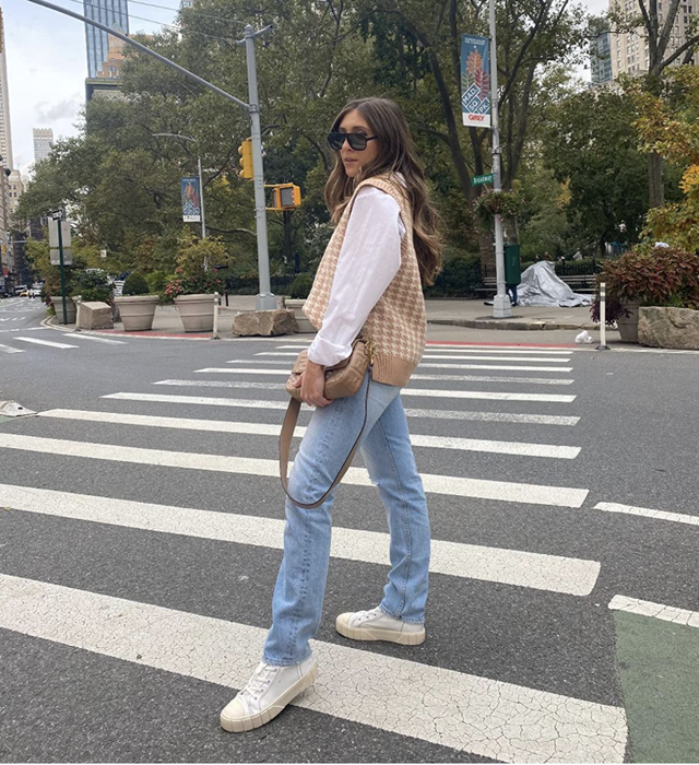 Reviewer wearing a khaki houndstooth vest