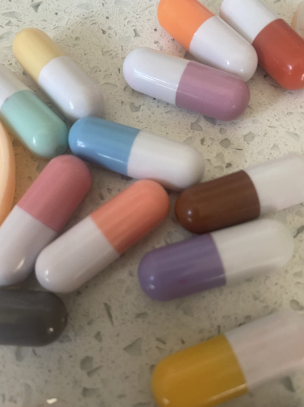 reviewer image of pill-shaped lipsticks