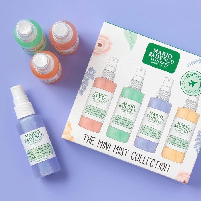 The gift box with the four spray bottles arranged neatly beside it