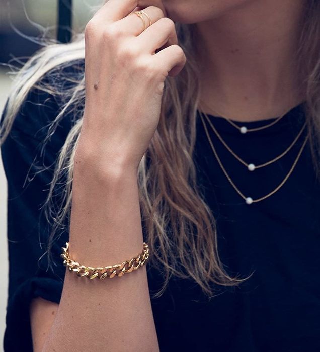 model showcasing the gold chain bracelet