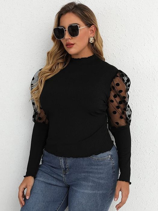 model wearing the black puff-sleeve top