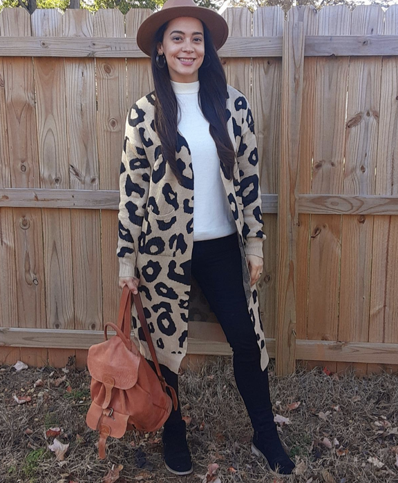 reviewer showcasing the leopard print long open-front cardigan with pockets