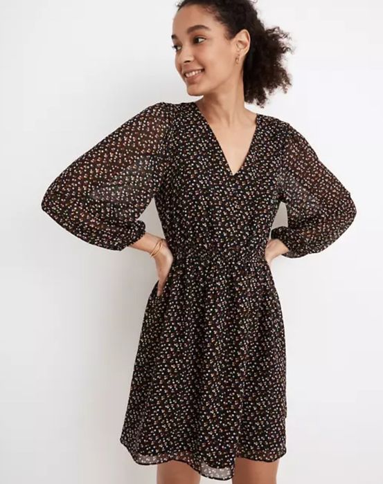 model rocking the brown dress with playful red and white polka dots