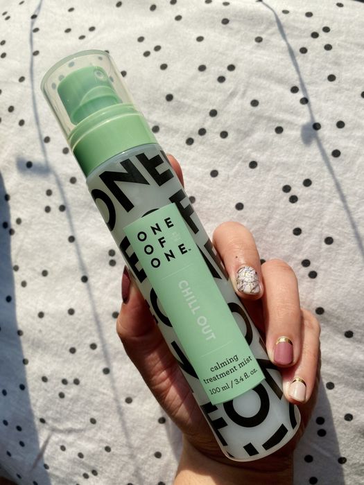 Mytour editor holding the green spray bottle.