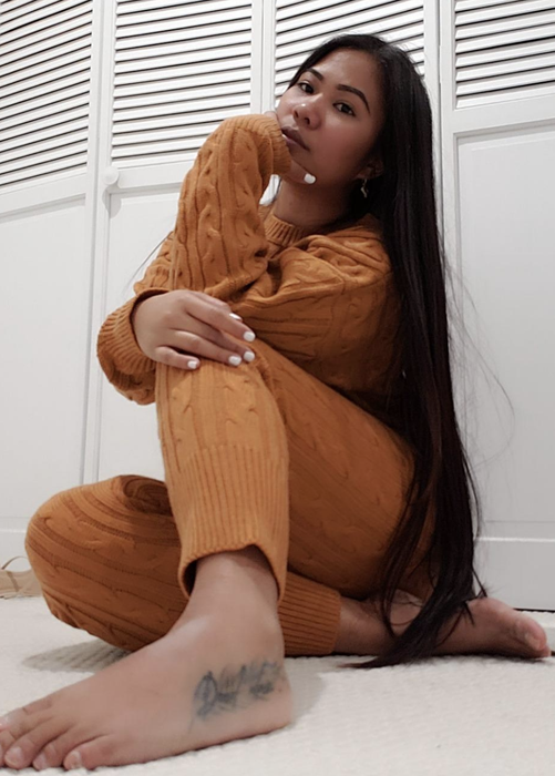reviewer wearing the set in camel