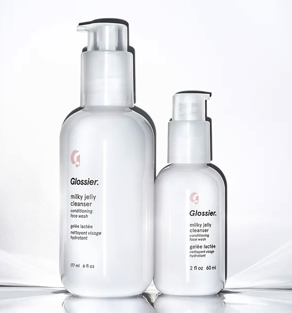 The full-size and mini-size cleanser bottles side by side