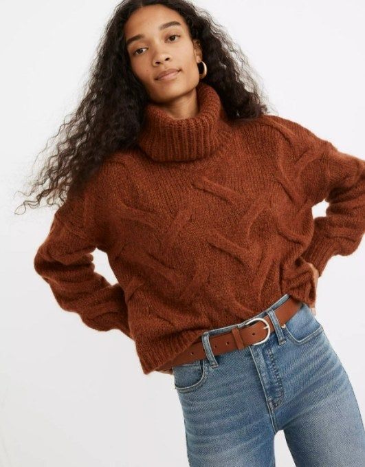 model showcasing the brown sweater paired with jeans and a matching brown belt