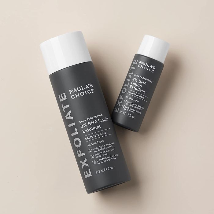 The 1-ounce travel-size bottle is placed next to the full-size 4-ounce bottle of the exfoliant.