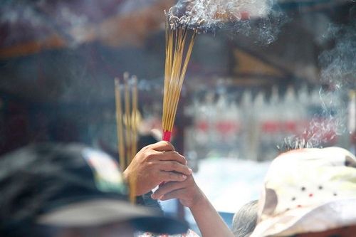 Lighting incense for ancestor worship during Tet