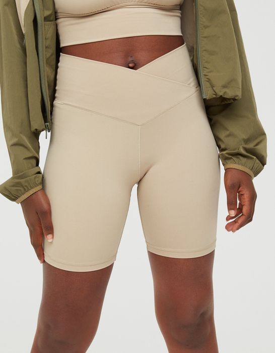 model showcasing light tan crossover waistband bike shorts