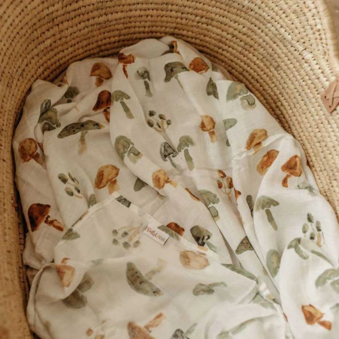 A mushroom-print swaddle blanket