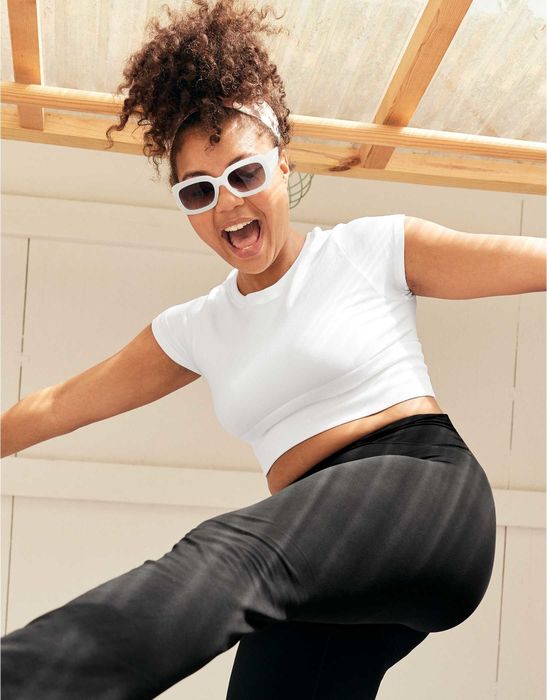 Model in a white short-sleeve tee.