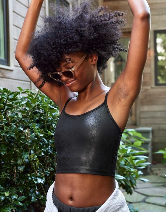 model wearing the metallic black and silver sports bra