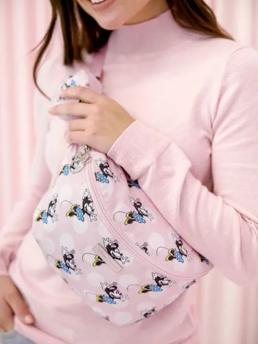 A model wearing the adorable pink Minnie Mouse sling bag