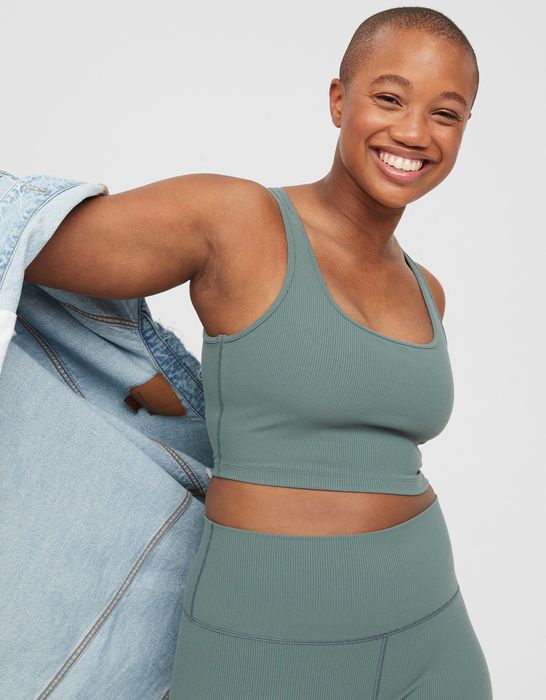 model wearing a sage green round-neck sports bra