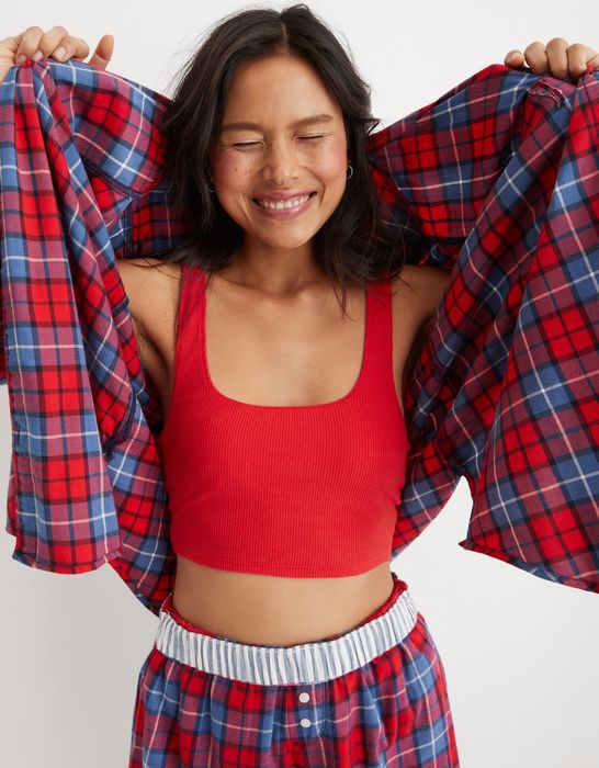 The model is showcasing the rubber round-neck front of the bra.