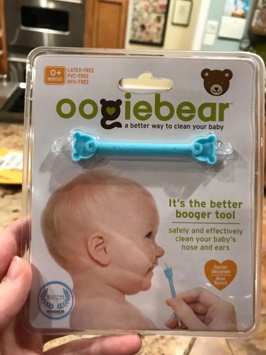 A reviewer shares a photo of the booger-cleaning tool still in its packaging