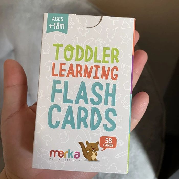 A reviewer holding the pack of flash cards