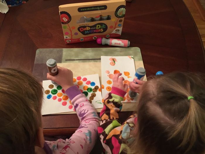 reviewer's kids creating dot art with the markers