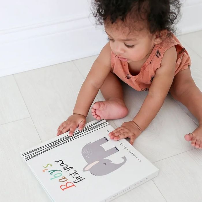 A baby and a baby book
