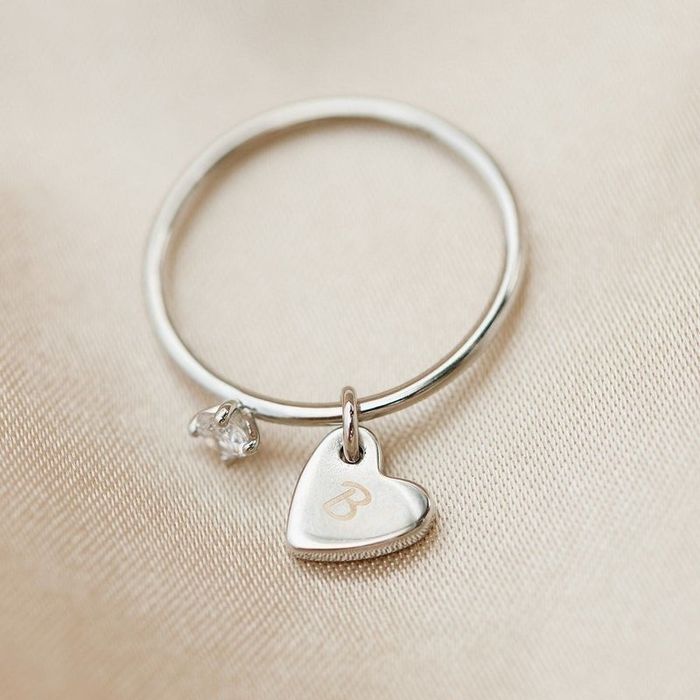 An image showcasing a silver heart-shaped ring