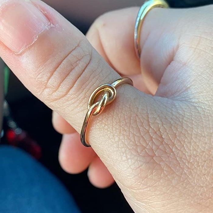 Reviewer wearing a gold ring