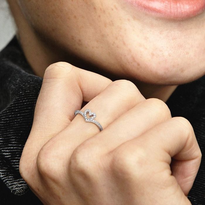 Model showcasing a silver heart ring