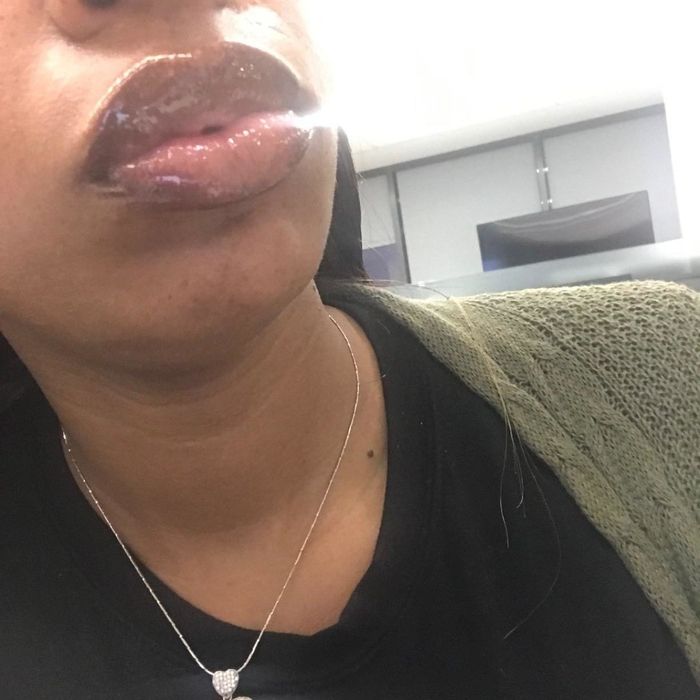 A reviewer modeling the lip gloss