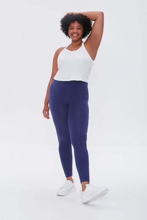 a model styling the blue leggings