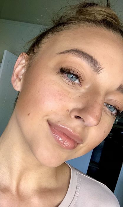 reviewer wearing the stone colored gloss