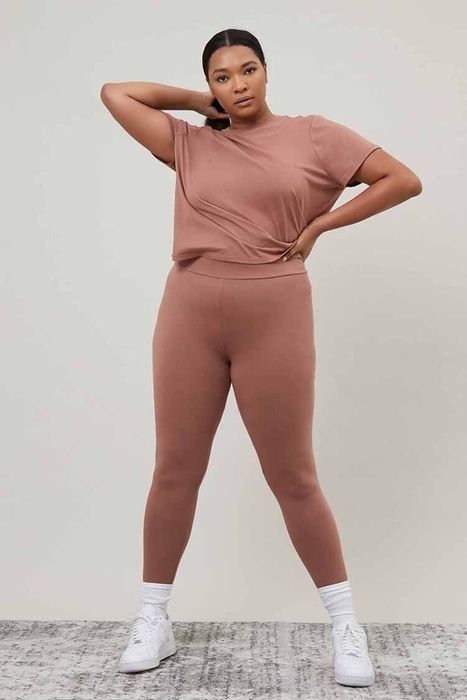 a model wearing the mauve-colored leggings