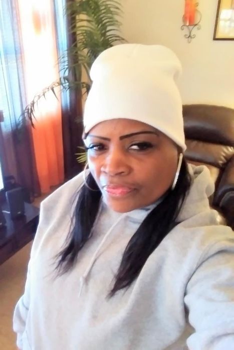 a reviewer wearing the white beanie