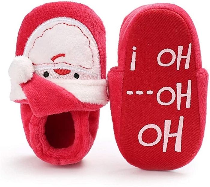 The top of a baby bootie shaped like Santa, with the bottom saying ho ho ho.
