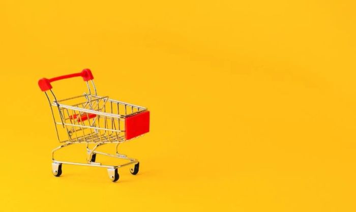 Hình nền Black Friday màu vàng với xe đẩy