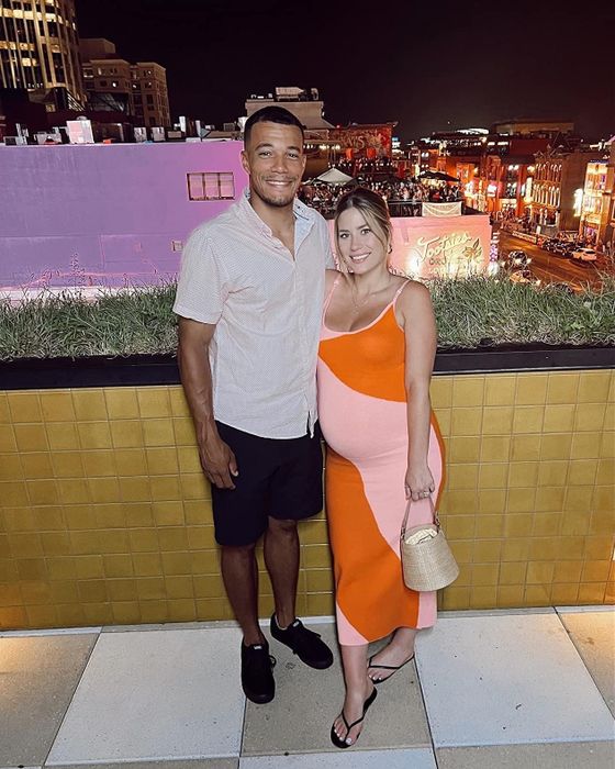 A reviewer in the orange and blush maxi, highlighting its comfort, breathability, and stylish design.