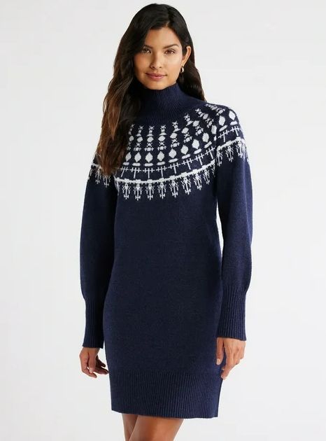 model wearing a navy sweater dress with a patterned neckline