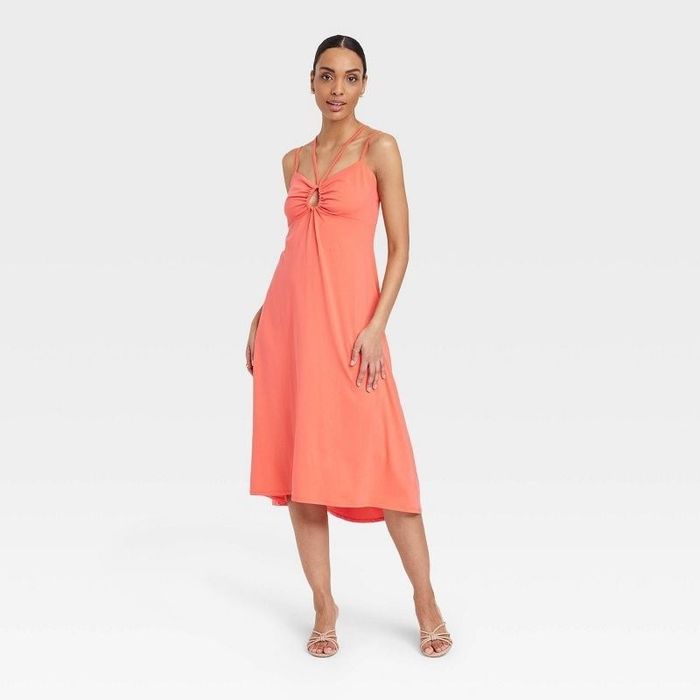 Model showcasing the orange dress