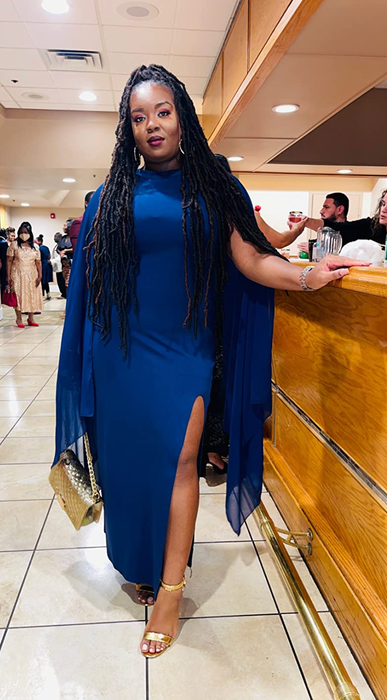 another reviewer wearing the blue version of the dress