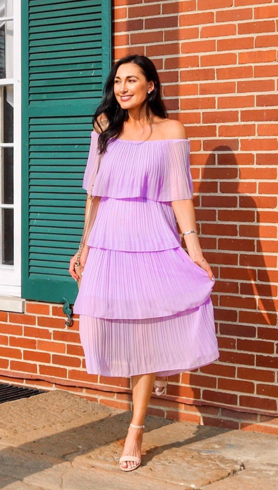 a reviewer modeling the dress in a soft lilac shade