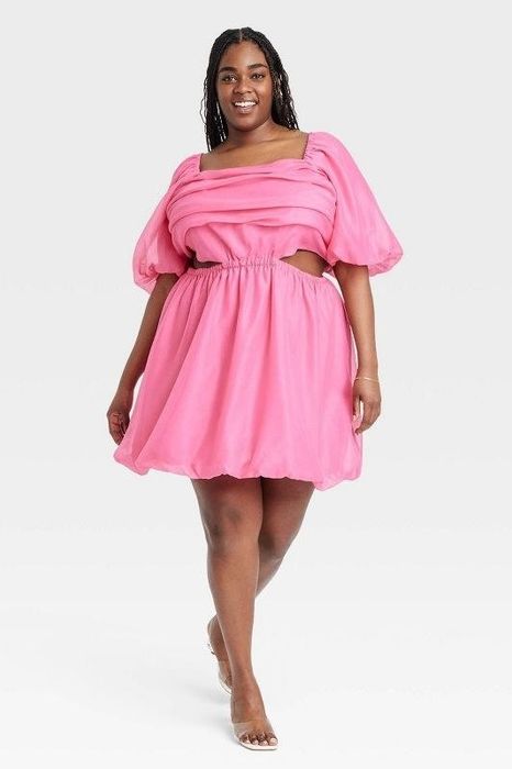 Model showcasing the pink dress