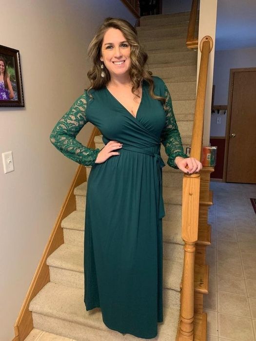 reviewer wearing the high-waisted maxi wrap dress with a deep V-neck and full lace sleeves