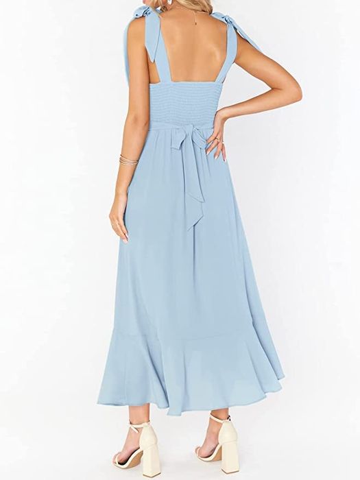 A back view of the same model wearing the dress