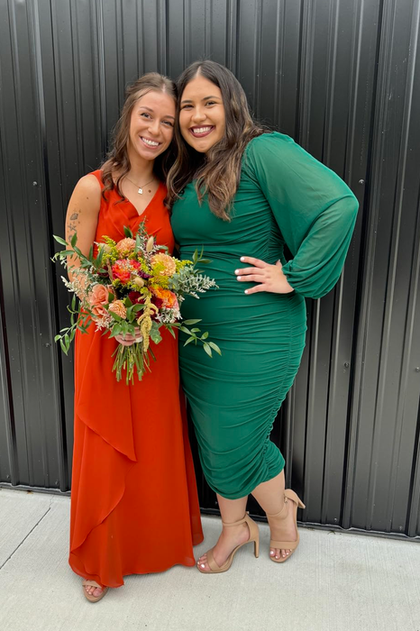 reviewer wearing a green puff-sleeve midi dress