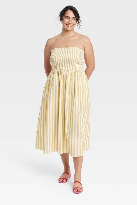 Model showcasing the yellow and white striped dress