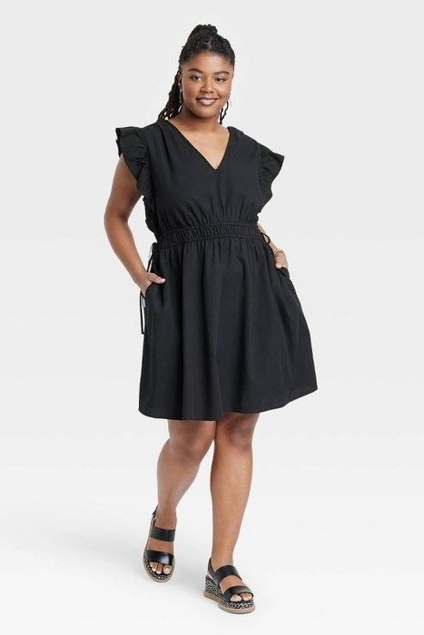 Model showcasing the black dress
