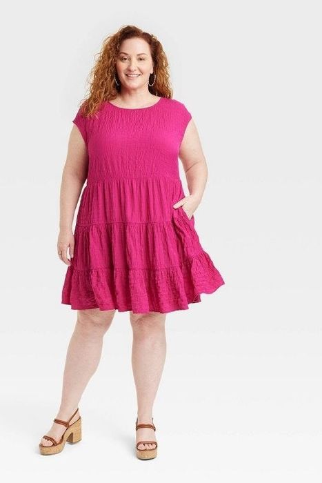 Model showcasing the magenta dress