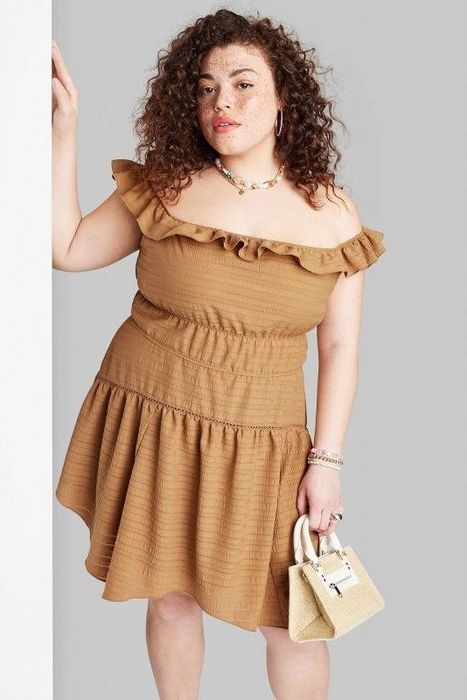 Model showcasing the cognac dress