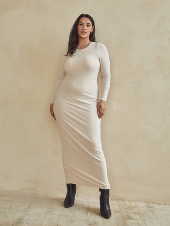 model showcasing a cream-colored maxi sweater dress