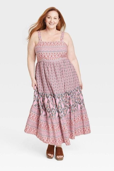 Model showcasing the pink floral dress