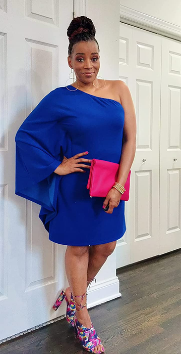 A reviewer wearing the blue one-sleeve shift dress